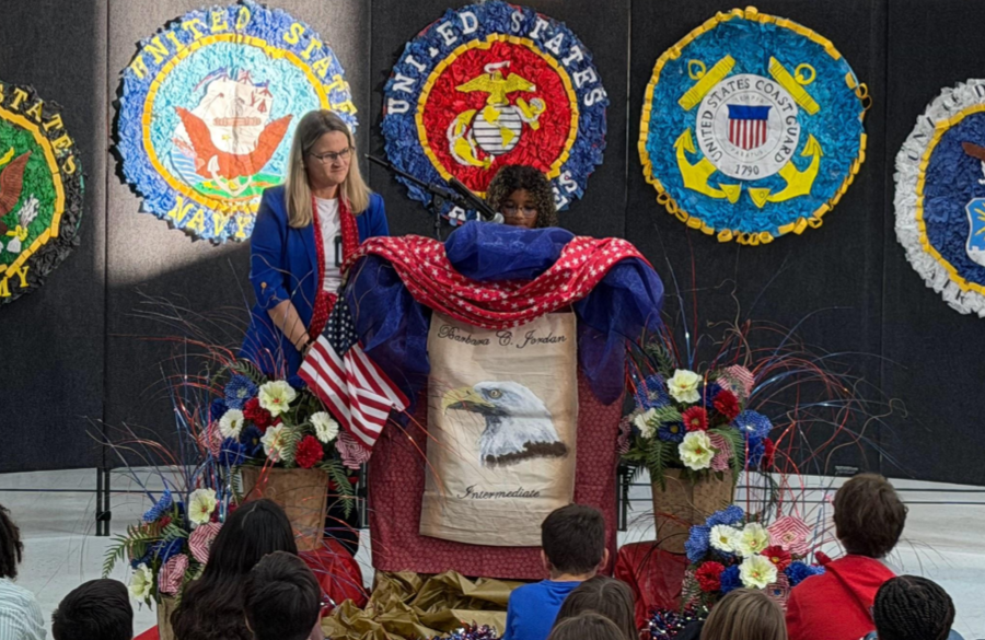 picture of a student speaking at the veterans day assembly