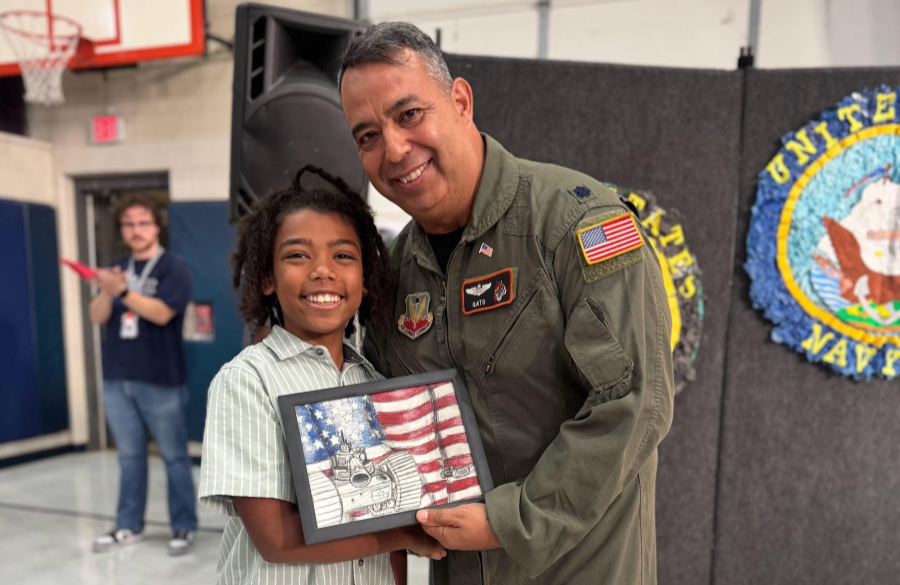picture of parent guest speaker receiving a thank you gift