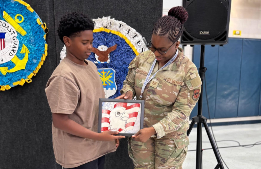 picture of a parent guest speaker receiving a thank you gift