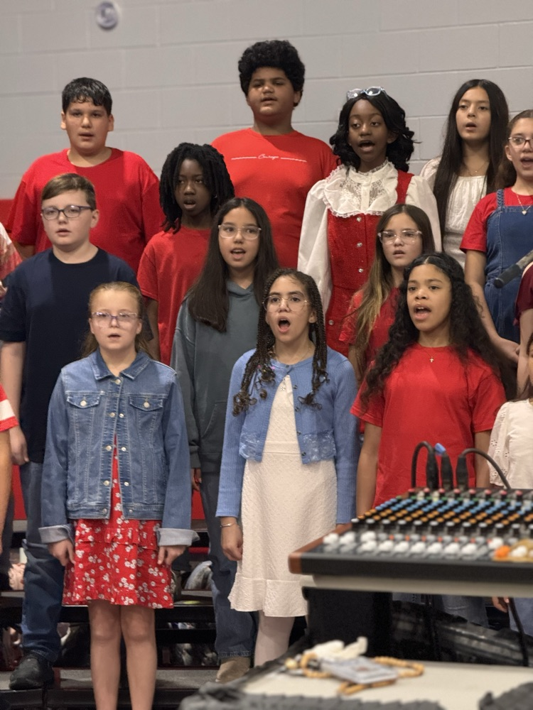 Prior students singing the national anthem