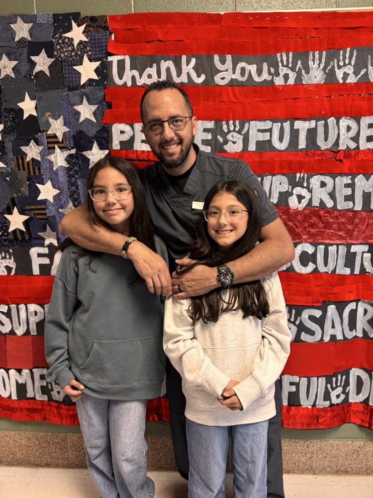 A veteran with his two daughters