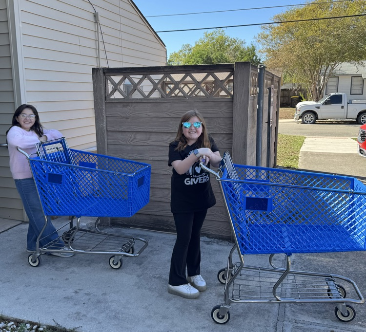 students making donation to RACAP