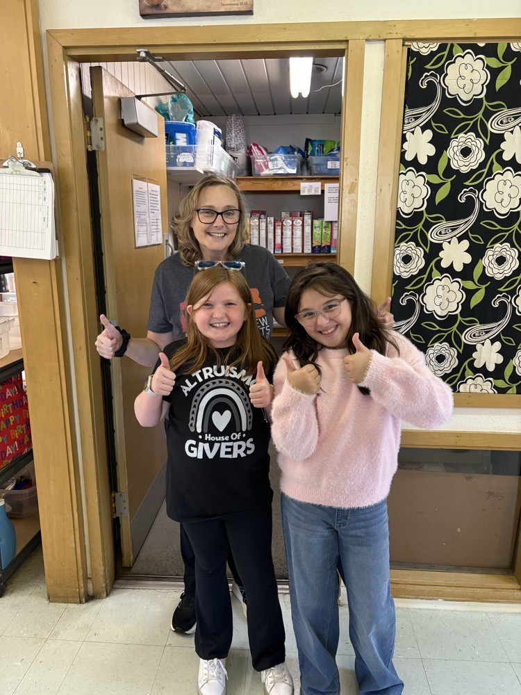 students making donation to RACAP