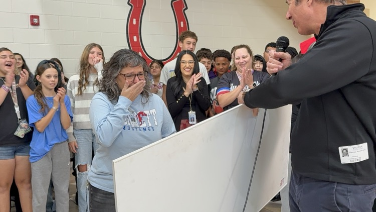 Tears at finding out she won $2,000!