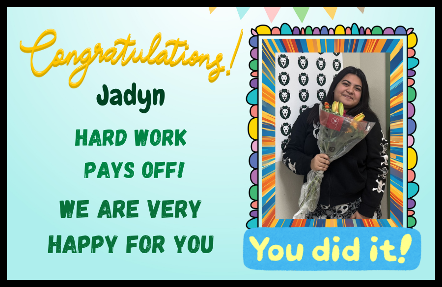 student holding bouquet of flowers posing for picture 