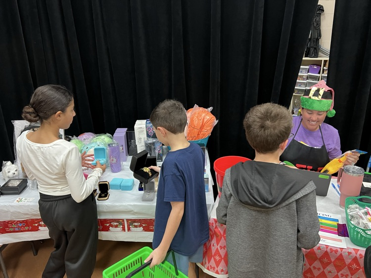 students shopping at winter holiday store 