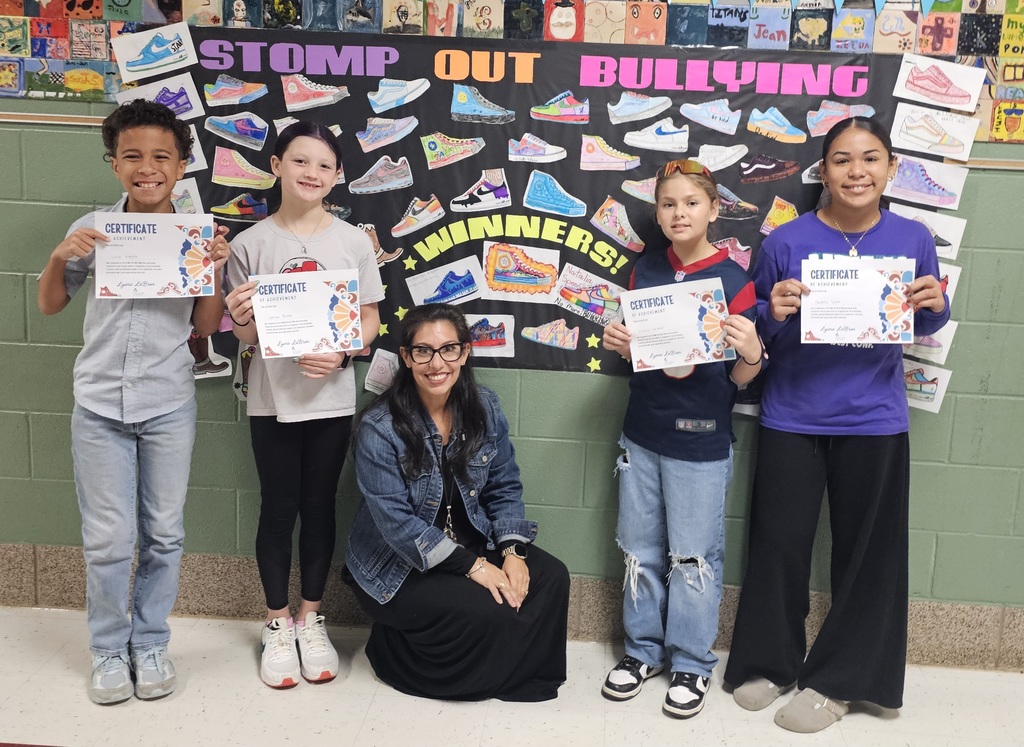 Labron and 4 student winners in front of the stomp out the bulling contest