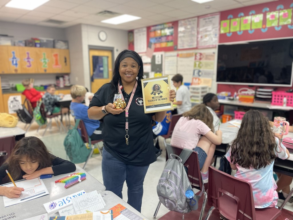Mrs Wahl with her awards in the classroom