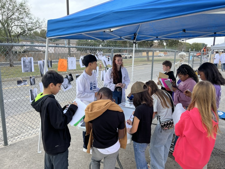 students taking notes about science lesson