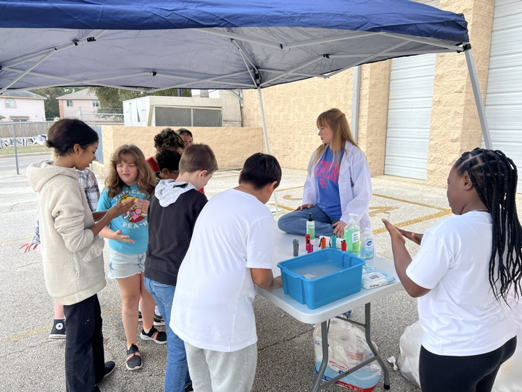 students doing a science experiment outside