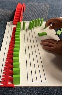 Kids playing with dominoes in their club