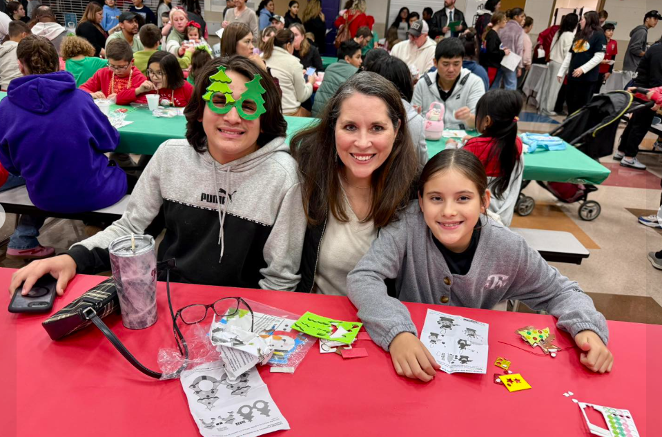 two kids posing with their mom