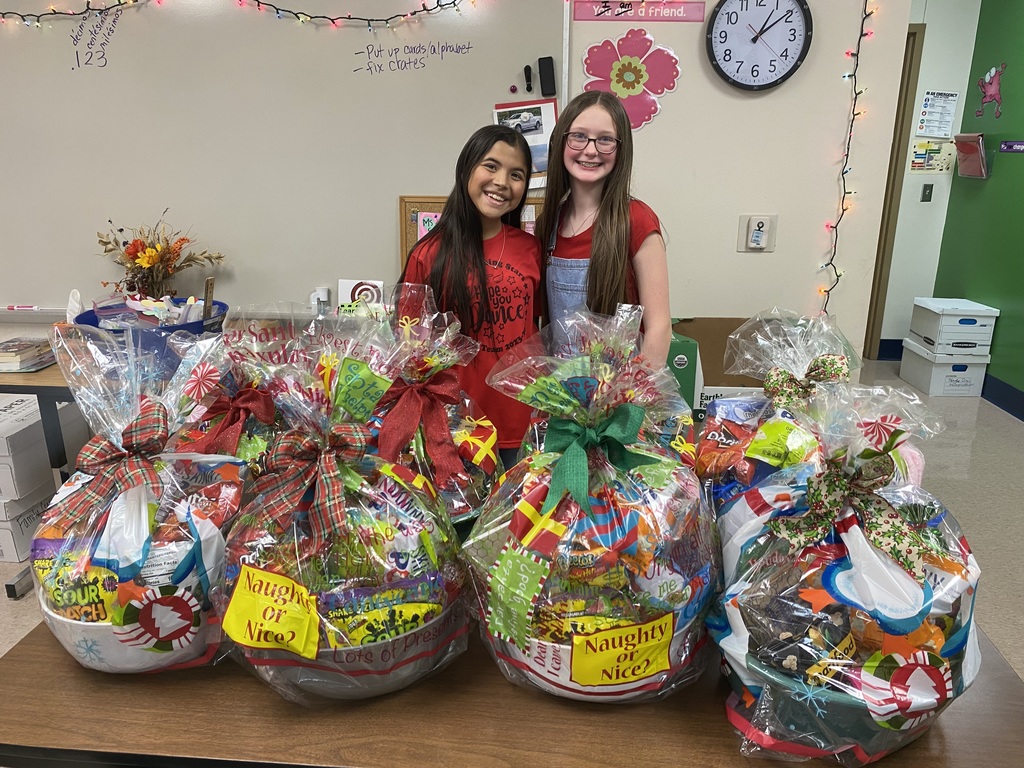 Two Student Council girls with gift baskets