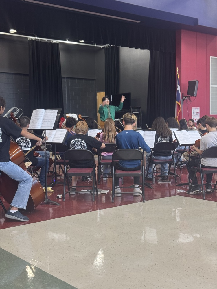 Students practicing in the cafeteria for their