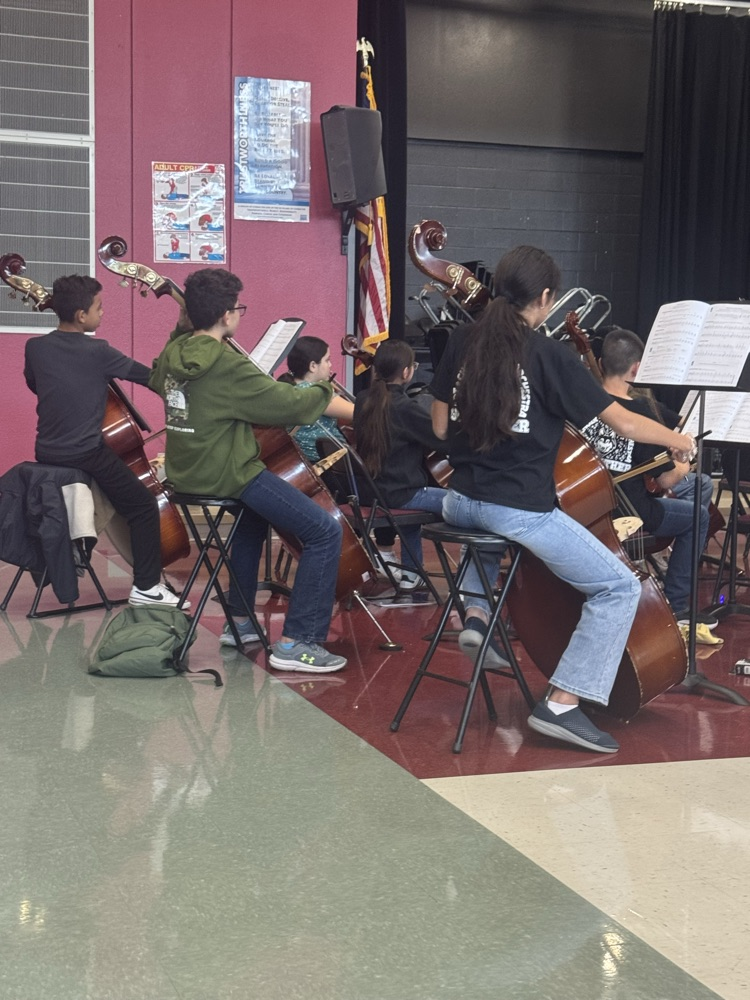 Students practicing in the cafeteria for their performance