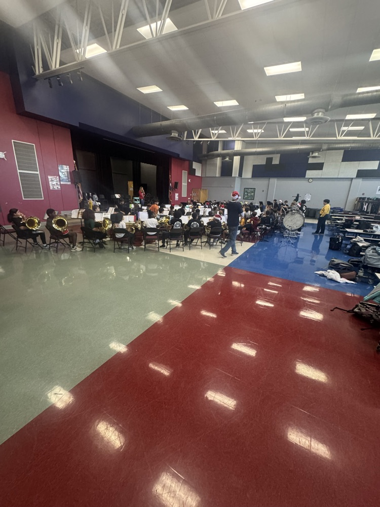 Student students practicing in the cafeteria for their performance