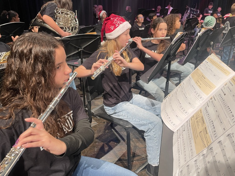 Students playing the flute on the stage