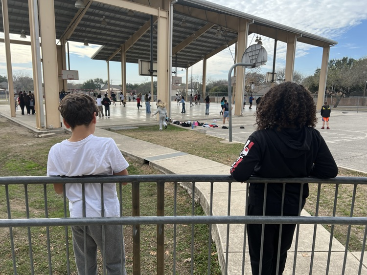 Two boys enjoying the fresh air at recess