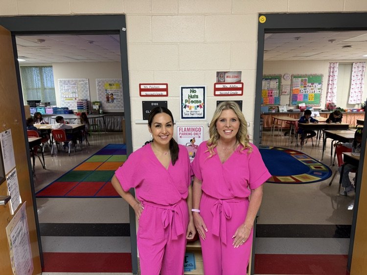 Ms. Aldis and Mrs. Paulsen in the same pink outfit
