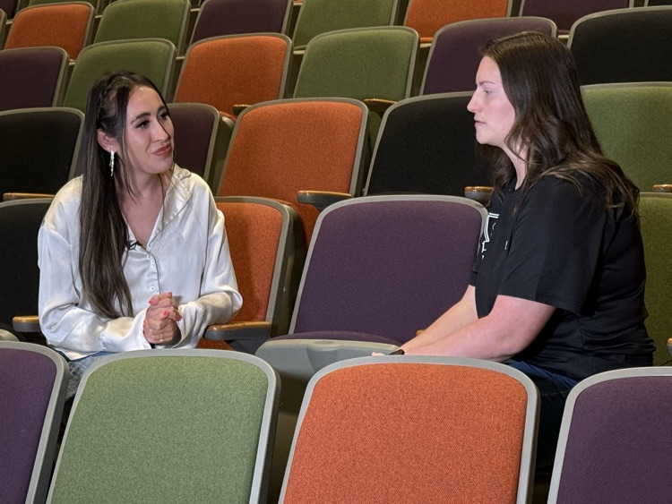 Alexia Beasley (right), Steele HS Director of Band, is interviewed.