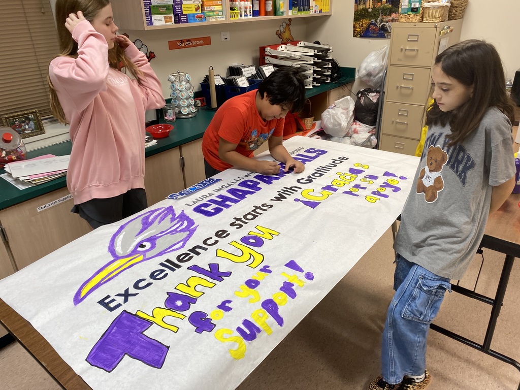 students finishing up thier poster