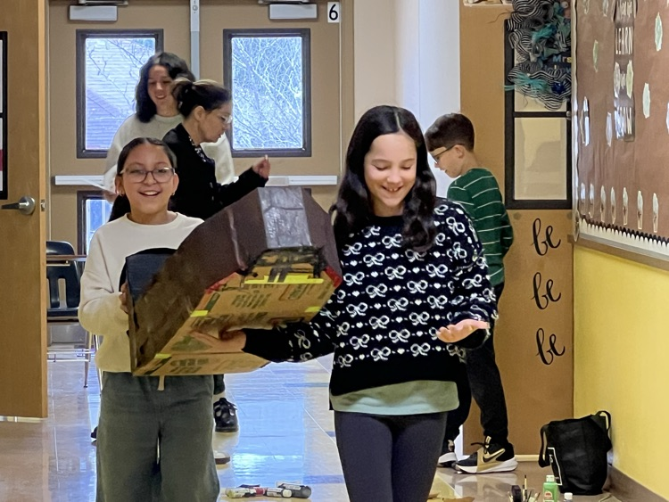 two girls holding their movie prop