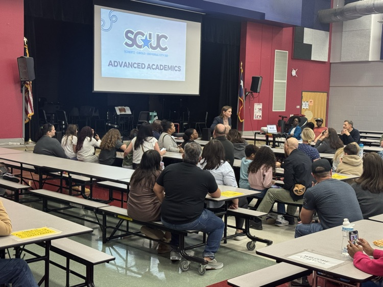parents sitting in the cafeteria