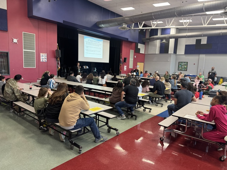Parents sitting in the cafeteria, listening to your presentation