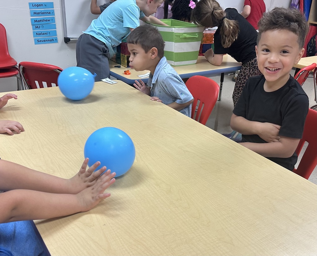 students learning about push and pull with balloons