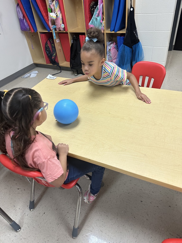 students learning about push and pull with balloons