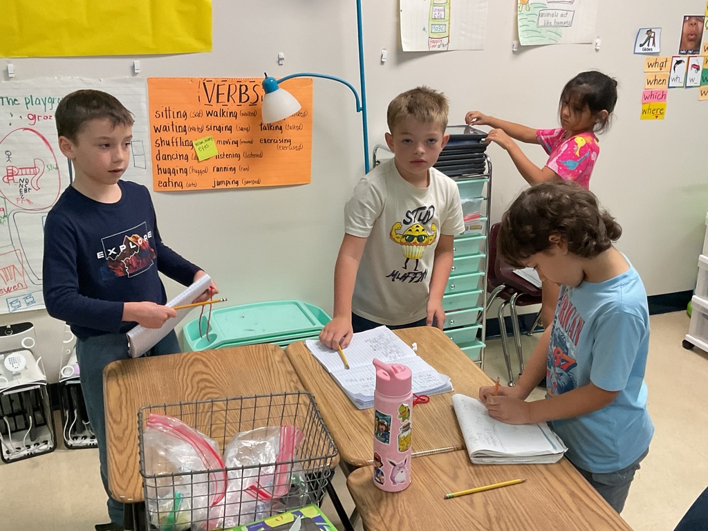 First graders measuring classroom objects. 