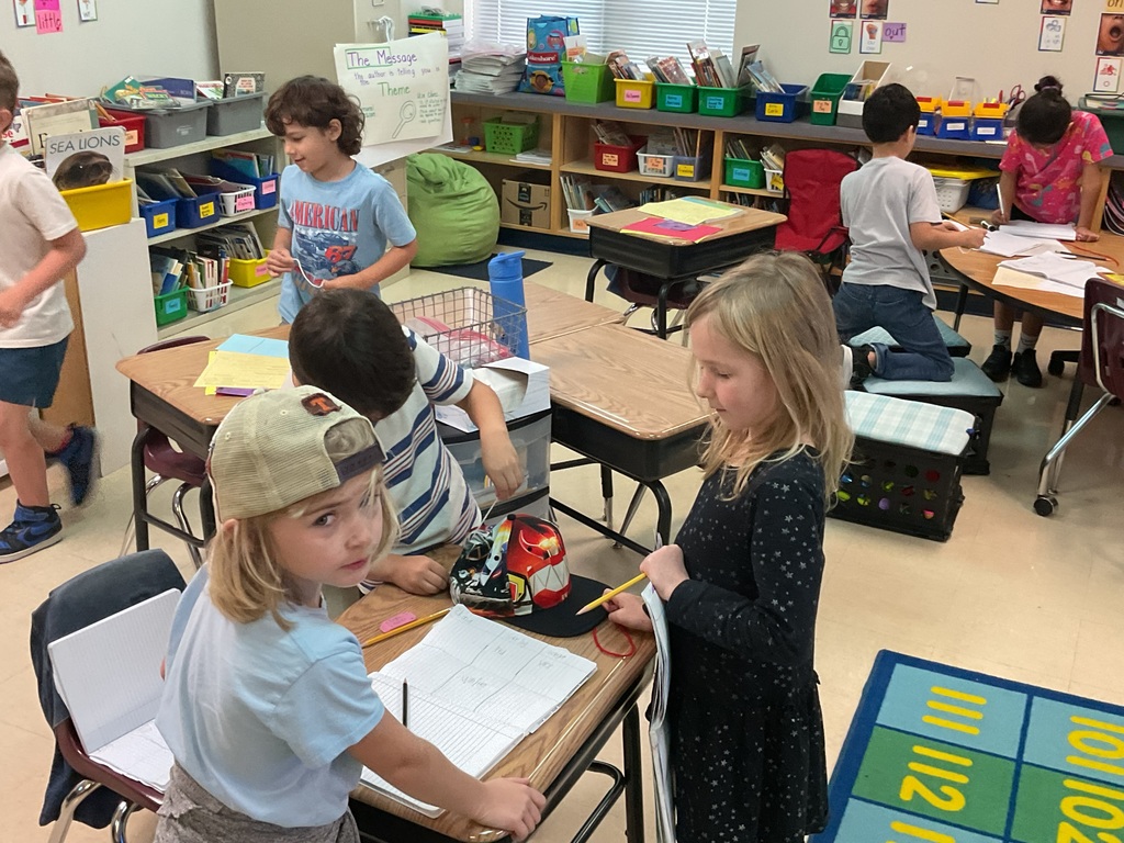 First graders measuring classroom objects. 