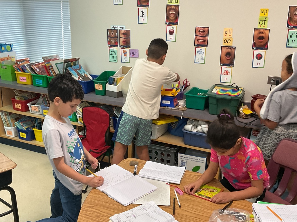 First graders measuring classroom objects. 