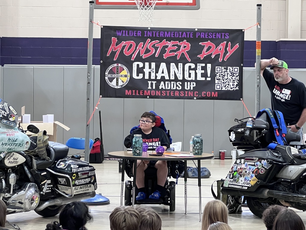 Gaven sitting underneath the Monster Day banner.