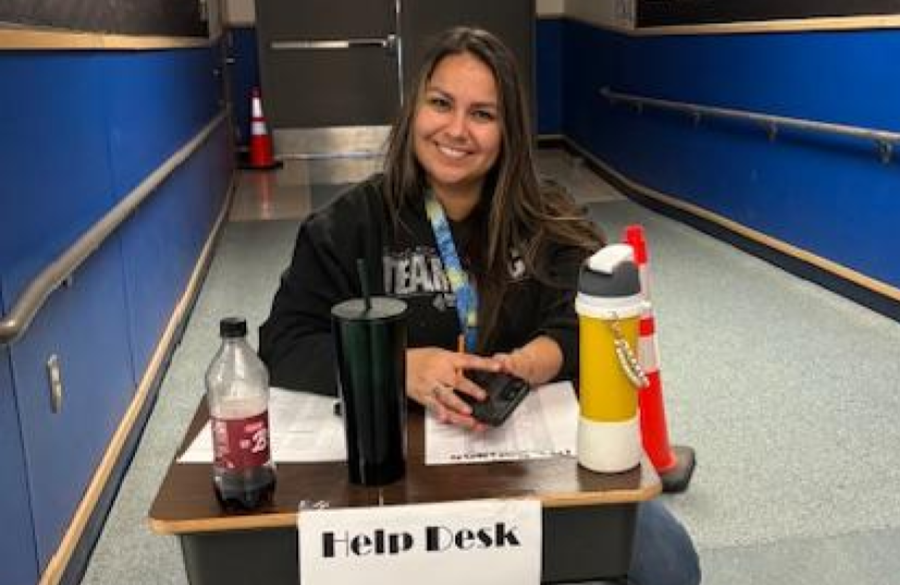picture of Ms Soriano at the help desk of Solo & Ensemble contest