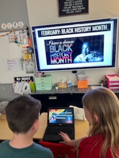 4th grade students presenting their work for black history month