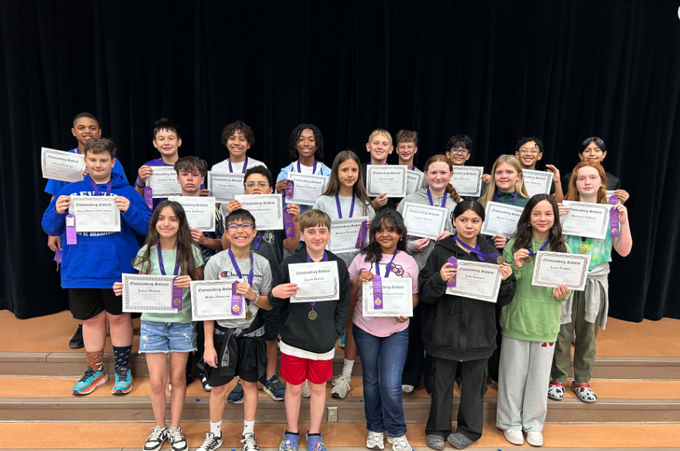 Band kiddos holding certificate of aceivement