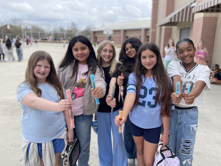 group of girls having a popsicle outside