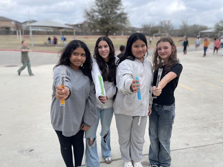 group of girls having a popsicle outside