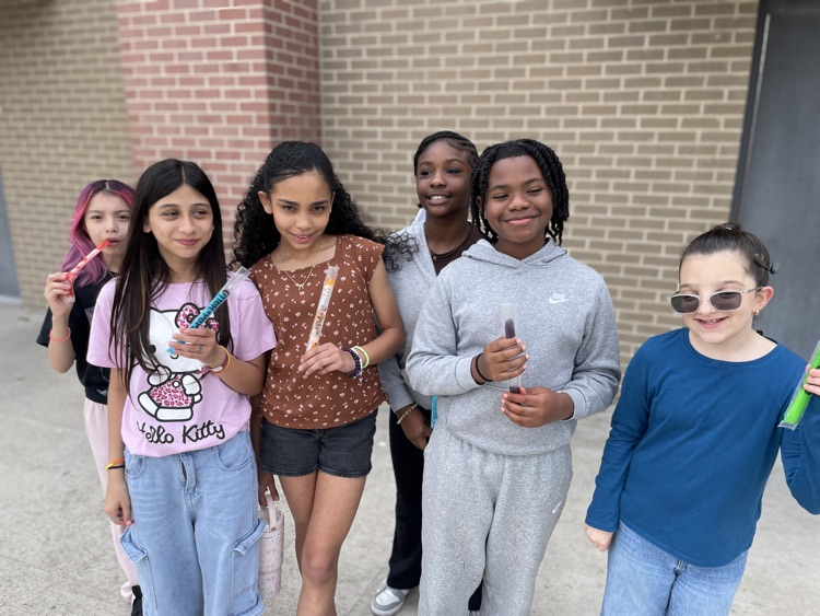 groups of 5th graders having a popsicle outside