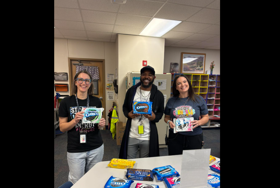 teachers holding up oreos