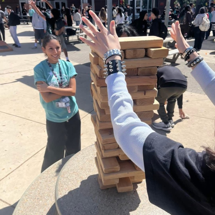 students playing giant jenga