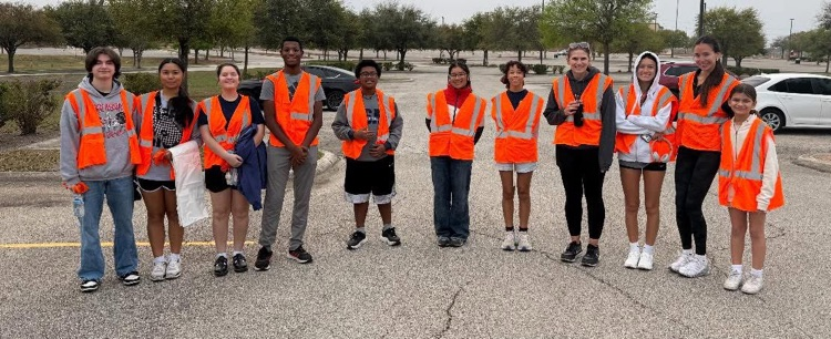 students in orange safety vests