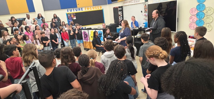 choir listening to a teacher