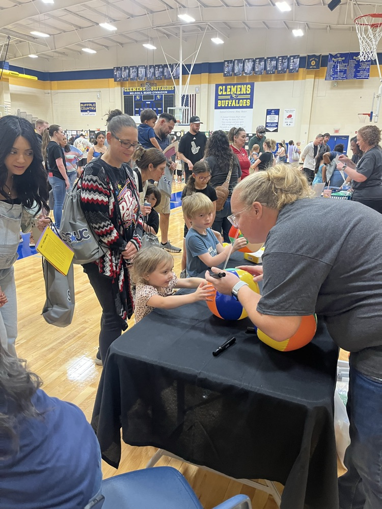 adult interacting with a three year-old going over letters and sounds