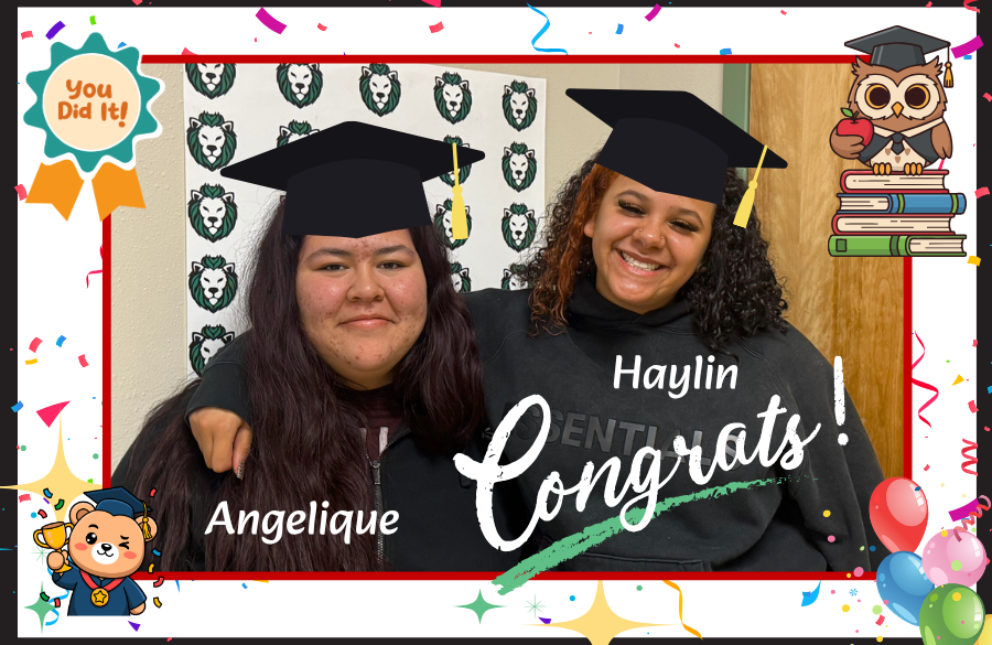 2 female students graduated and posing for picture