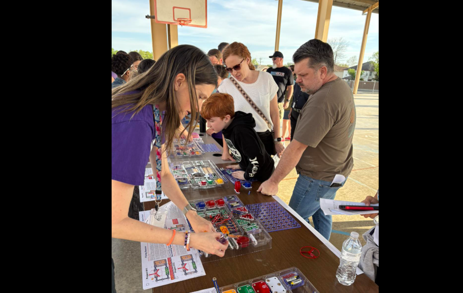 Mrs. Davis helping with an activity