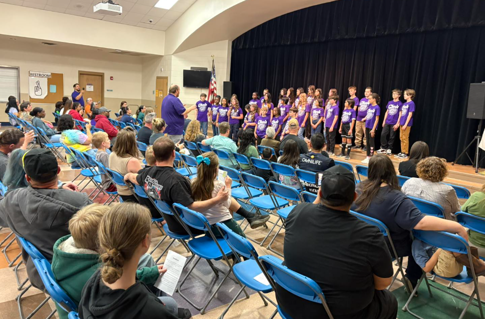 choir students singing in cafe