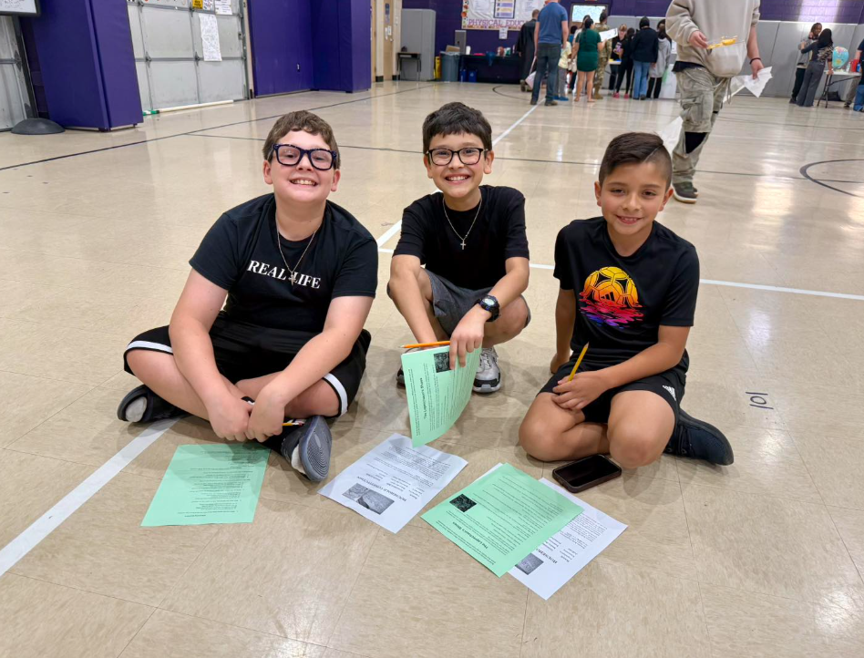 Three 5th grade students in gym