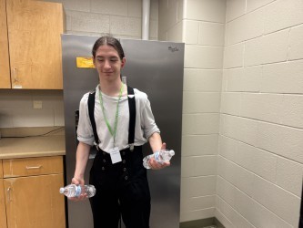 student getting water